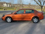 2005 Chevrolet Cobalt LS in great condition with sunroof and low mileage, parked outdoors