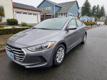 2017 Hyundai Elantra in gray, showcasing its clean design and good condition, parked on a residential street