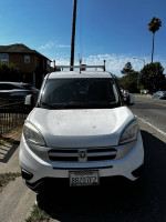Front view of a 2006 Dodge Promaster City van, ideal for trades, with some exterior dings and a clean interior.