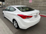 2014 Hyundai Elantra with 89,000 miles, one owner, clean Carfax, parked on street