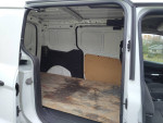 Interior view of 2018 Ford Transit Connect cargo van showing spacious cargo area with wooden flooring.
