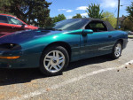 1995 Chevrolet Camaro Z28 convertible in mystic teal color, parked with low mileage and neat exterior.