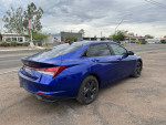 2021 blue Hyundai Elantra SEL parked, showcasing alloy wheels and sleek design in excellent condition.