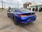 2021 Hyundai Elantra Blue FWD parked with new tires and alloy wheels, showcasing excellent condition.