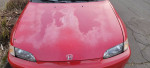Front view of a red 1993 Honda Civic DX with minor wear and tear, featuring manual transmission and new tires.