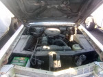 1964 Cadillac DeVille engine bay showcasing the 429 V8 motor and components ready for restoration