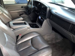 Interior view of a 2005 Chevrolet Tahoe Z71 with leather seats and spacious design.