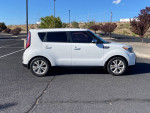 2014 Kia Soul in white with 147,000 miles, showcasing modern design and clean condition.