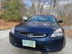 2005 Honda EX-L V6 with sunroof, leather seats, and alloy wheels, showcased on a clear day.
