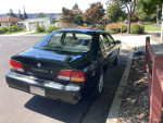 1997 Nissan Maxima, black sedan parked on the street, has new brakes and tires, 50,000 miles.