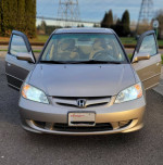 2004 Honda Civic EX with open doors, showcasing its interior, available for sale with low mileage.