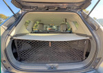 2012 Toyota Prius V5 cargo area with net and clean interior, ideal for family or delivery use.