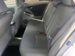 Interior view of a 2010 Toyota Prius showing grey seating and spacious backseat area
