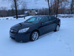 2013 Chevrolet Malibu LT FWD parked in snow, featuring touch screen, navigation, and new winter tires.