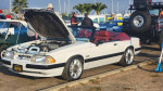 1989 Ford Mustang LX 5.0 convertible with low mileage and Eibach springs at a car show