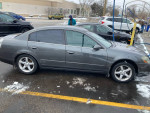 2006 Nissan Altima 3.5 SE FWD parked with snow, showing exterior and alloy wheels