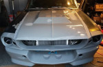 Front view of a 1967 Ford Mustang Fastback project car needing completion and restoration.