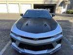 Front view of a 2018 Chevrolet Camaro 1SS with dark hood and performance features, parked in a lot