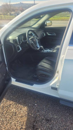 Interior view of a clean 2011 Chevrolet Equinox SUV with leather seats and advanced features.