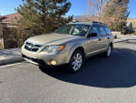 2008 Subaru Outback in excellent condition, 4-cylinder, all-wheel drive, parked on a residential street.