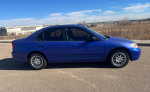 2003 Honda Civic in good condition with aftermarket wheels and new tires, parked outdoors
