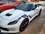 2014 Chevrolet Corvette with distinctive styling, parked outside, showcasing its sleek design and performance features.