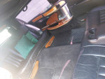 Interior view of a 2004 Lincoln town limo with leather seating and wooden accents