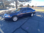 2008 Chevrolet Impala in excellent condition with low mileage parked on the street