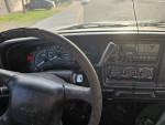 Interior view of a 2002 Chevrolet Silverado 1500 showing the steering wheel and dashboard features.