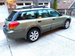 2006 Subaru Forester 2.5 X Wagon in green parked, showcasing clean exterior, alloy wheels, and roof racks.