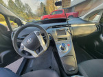 Interior view of 2013 Toyota Prius, featuring a clean dashboard and modern controls for hybrid efficiency.