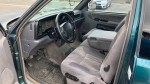 Interior view of a 1996 Dodge Ram 2500, showcasing the dashboard and seats with original features