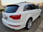 2009 Audi Q7 S-Line Premium Plus in white, showcasing its stylish rear design and tinted windows.