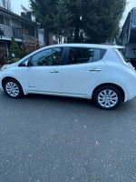 Side view of a 2017 Nissan Leaf S, a stylish electric vehicle ideal for eco-friendly driving.