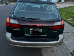 2002 Subaru Outback Legacy rear view with original paint and clean body, showcasing low mileage and AWD features.