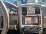 Interior view of a 2006 Chrysler 300 with multimedia system and leather seats, priced at $6,000.