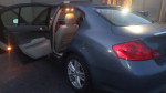2010 Infiniti G37 in great condition with open door, showcasing spacious interior and stylish design.