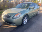 2007 Nissan Altima 3.5se in green color, one owner, dealer maintained with aluminum wheels and new tires
