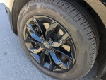 Close-up of 2013 Volkswagen Jetta TDI black alloy wheel and tire, showcasing excellent condition and tread.
