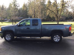 2012 GMC Sierra Z71 4X4 in excellent condition, featuring extra cab and tow package, parked outdoors.