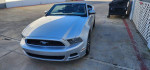 2014 Ford Mustang Convertible in silver with GT wheels, clean title and 69K miles, parked outdoors.