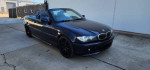 2004 BMW 330i Convertible with low miles, black rims, and pristine paint, showcasing sporty design and performance.