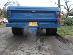 Rear view of a blue 1972 Ford F-250 dually truck with Oregon license plate and exhaust smoke.