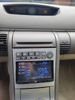 Interior view of a 2006 Infiniti G35 with upgraded Pioneer stereo and climate control.
