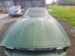 Front view of a 1973 Ford Mustang Grande, original condition with 90,521 miles, parked in a driveway.
