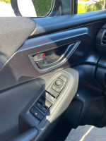 Interior controls of a 2024 Subaru Impreza RS with automatic window and mirror adjustments
