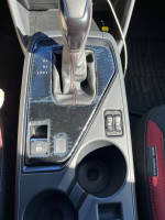 2024 Subaru Impreza RS interior gear shift and cup holders with modern features and design.