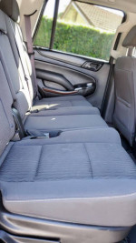 Clean backseat interior of a 2016 GMC Yukon for sale, showing spacious seating.