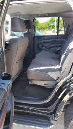 Interior view of a 2016 GMC Yukon showcasing clean seating with space for passengers