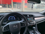 Interior view of a 2016 Honda Civic EX with digital dashboard and infotainment system.